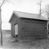 <p>Magazine (Building 113), built in 1885 and from ca. 1940 used as a blacksmith shop, looking east, mid-1930s.</p>